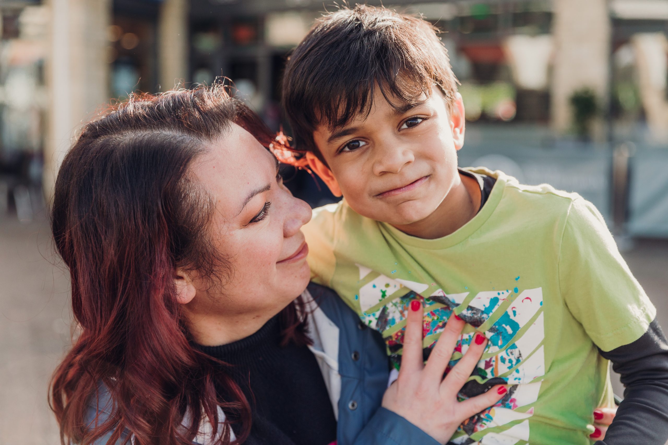woman and child hugging for a photo together